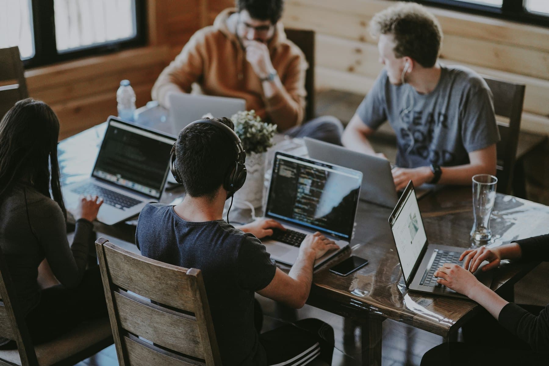 A group working side by side on laptops
